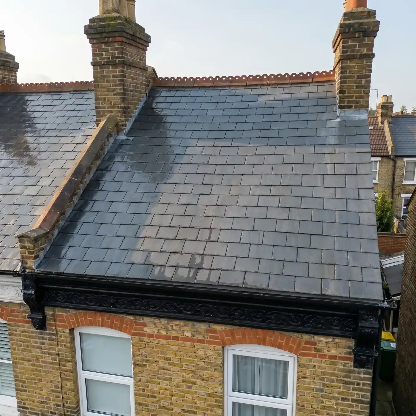 Same roof after low-pressure biocide treatment — Essex
